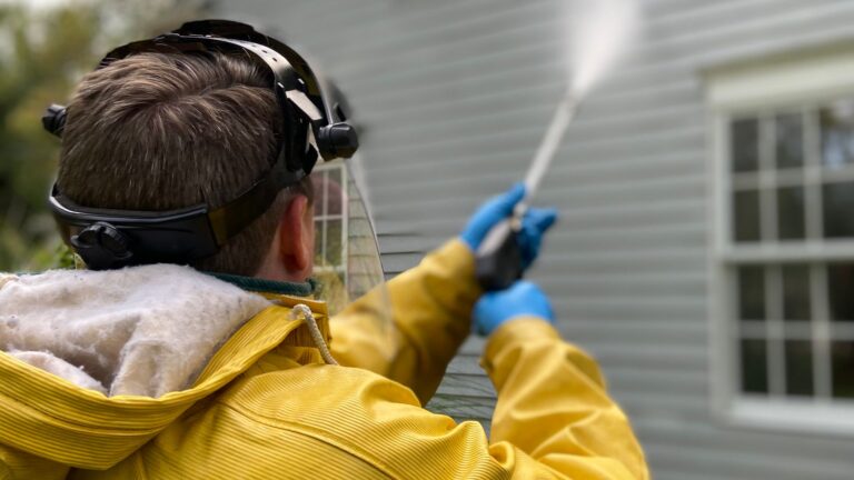 Exterior House Cleaning Guide by Surface Pressure washing a house exterior wall