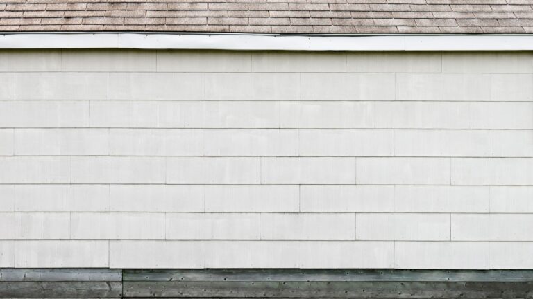 Why Does Vinyl Siding Look Chalky? Close-up of horizontal vinyl siding panels