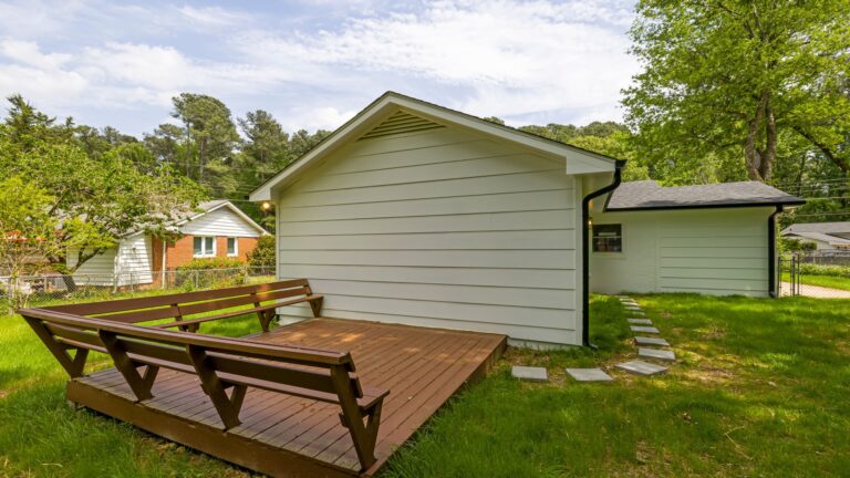 Wooden deck boards in a backyard.
