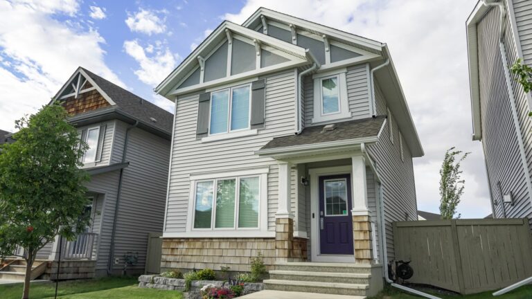 Two-story suburban home with horizontal lap vinyl siding