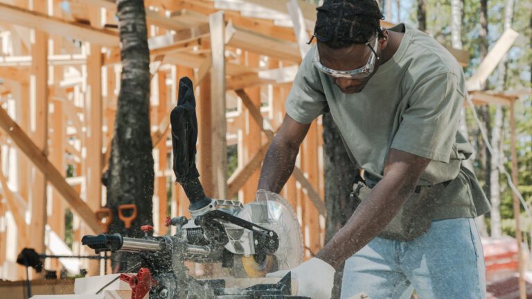 How to Cut Vinyl Siding Cleanly: Tools, Cuts and Common Mistakes A carpenter using a circular saw at an outdoor construction site